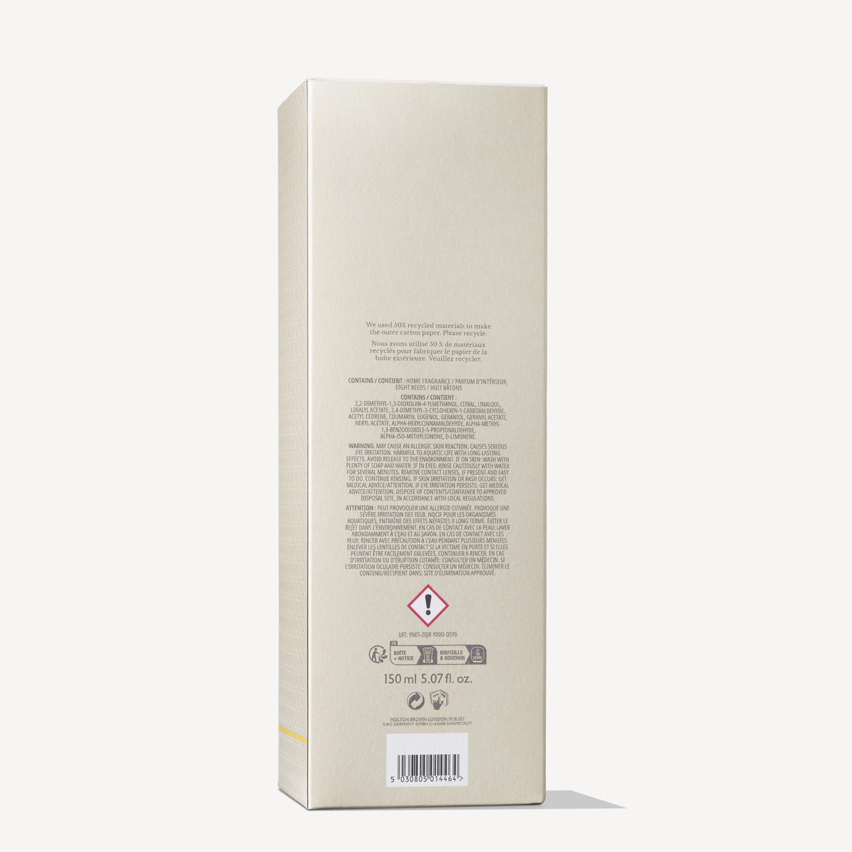 The image shows the back of a rectangular beige box for the MoltonBrown Cyprus Orange & Bergamot Aroma Reeds 150ml, displaying text and symbols. A triangular hazard symbol with an exclamation mark is visible. The volume at the bottom reads 150 ml 5.07 fl. oz., hinting at a fresh orange and bergamot fragrance within.