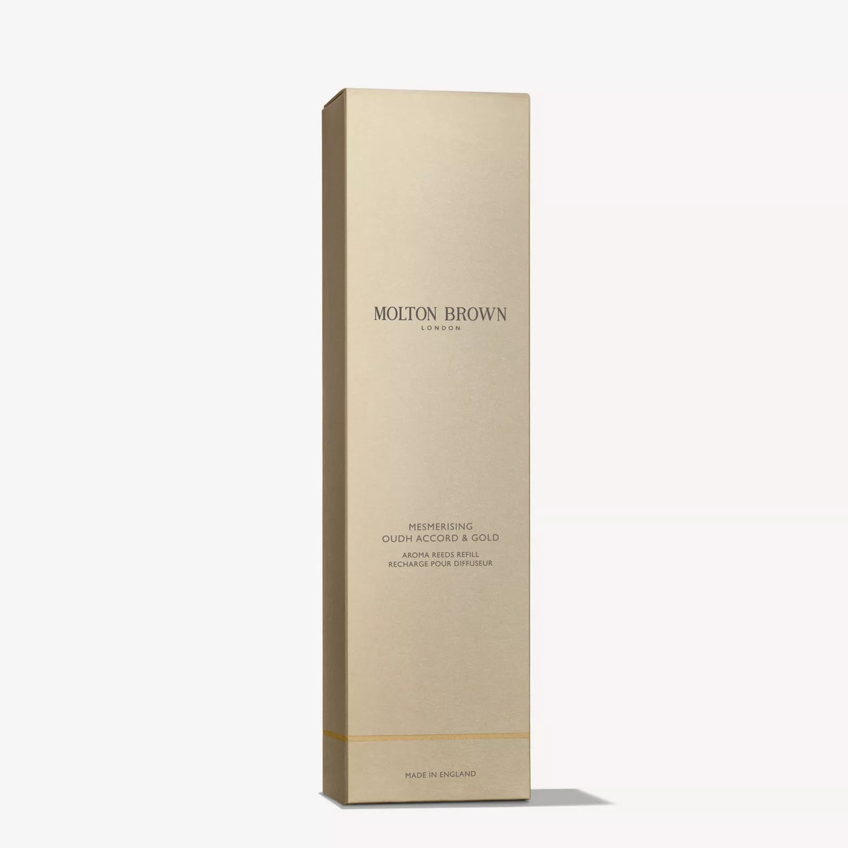 A tall, rectangular gold box labeled MoltonBrown Cyprus Mesmerising Oudh Accord & Gold Aroma Reeds Refill 150ml stands upright against a plain white background, ideal for enhancing your home fragrance experience.