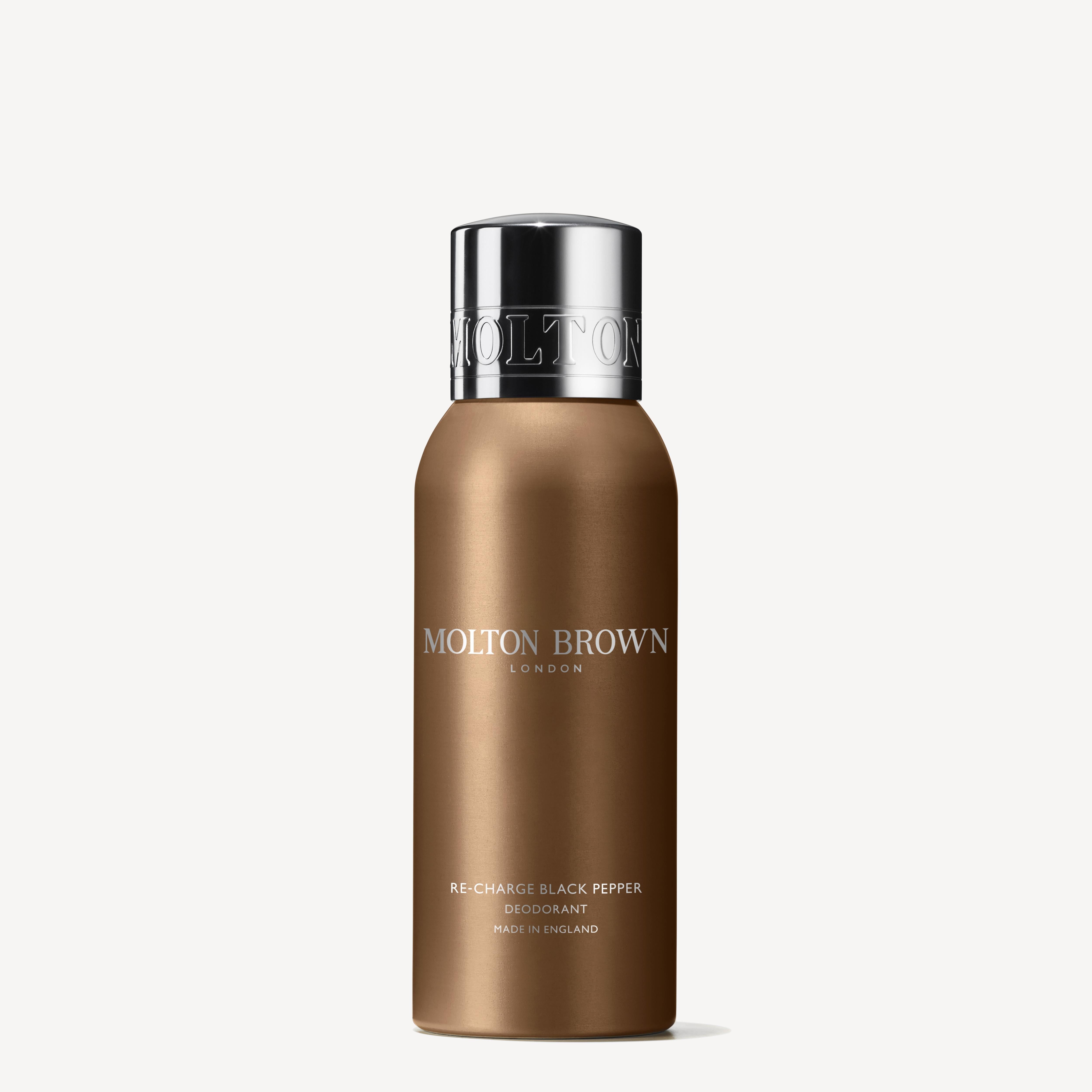 A cylindrical bottle of MoltonBrown Cyprus Re-charge Black Pepper Deodorant 150ml is shown. The label showcases the brand name in white text, with Re-charge Black Pepper featured below it. Known for its iconic scent that guarantees long-lasting freshness, the bottle is brown and topped with a metallic cap.
