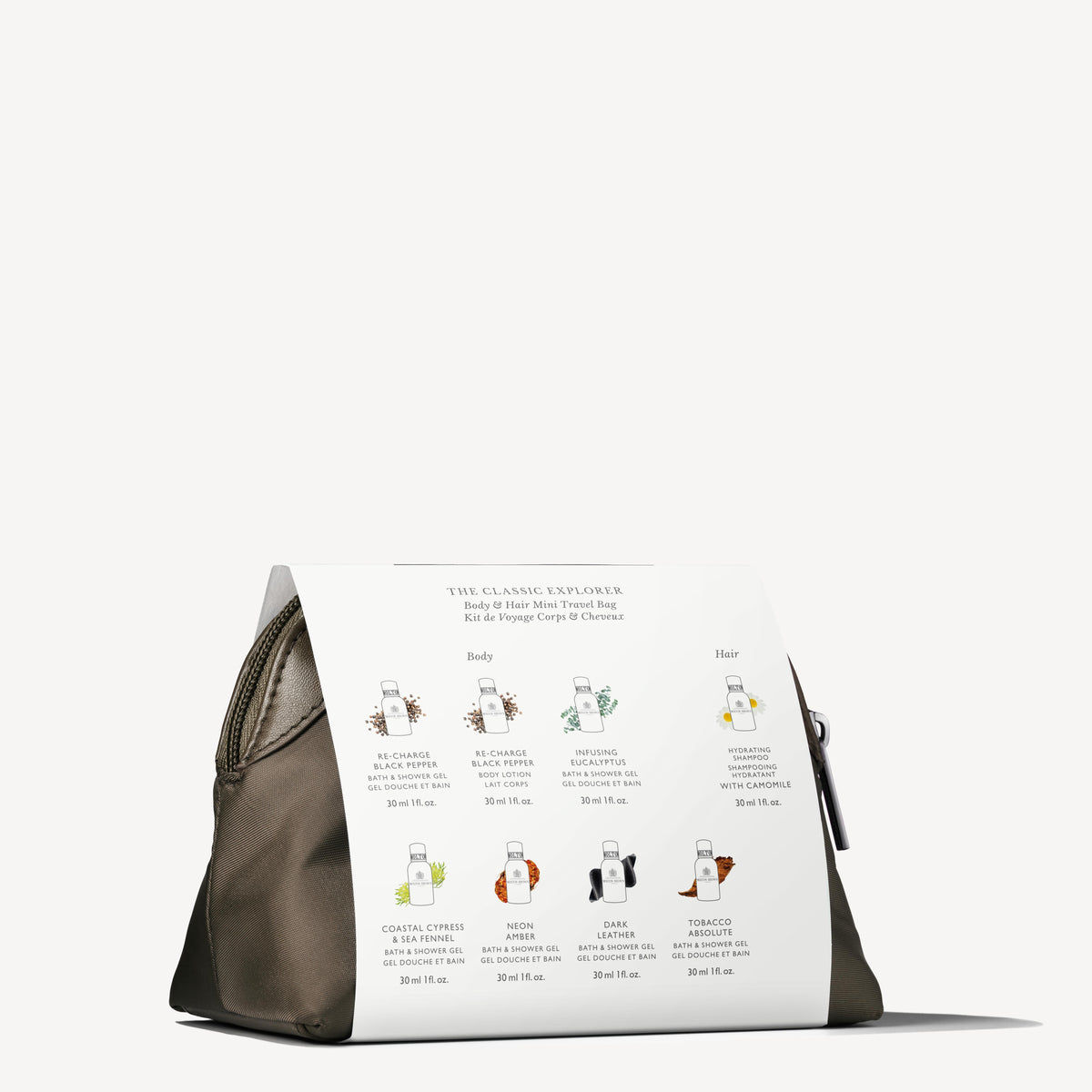 Meet the Classic Explorer Body & Hair Mini Travel Bag by MoltonBrown Cyprus, your reusable travel companion in khaki. It conveniently houses eight Bath Body and Hair Care miniatures, each offering a distinct scent such as Beach Club and Moon Flower. Ideal for enhancing your daily rituals, this bag also includes a handy side zipper.
