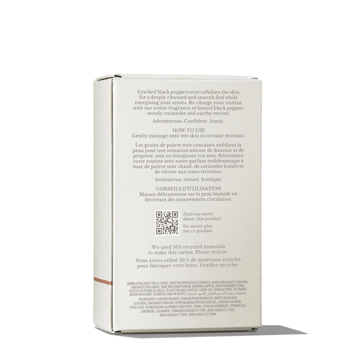 The image showcases the backside of a MoltonBrown Cyprus Re-charge Black Pepper Bodyscrub Bar 250g box, highlighting its ingredients and usage instructions. The box is positioned upright and features clear text describing its exfoliating properties, enriched with Madagascan black peppercorn oil and crafted from recycled materials.