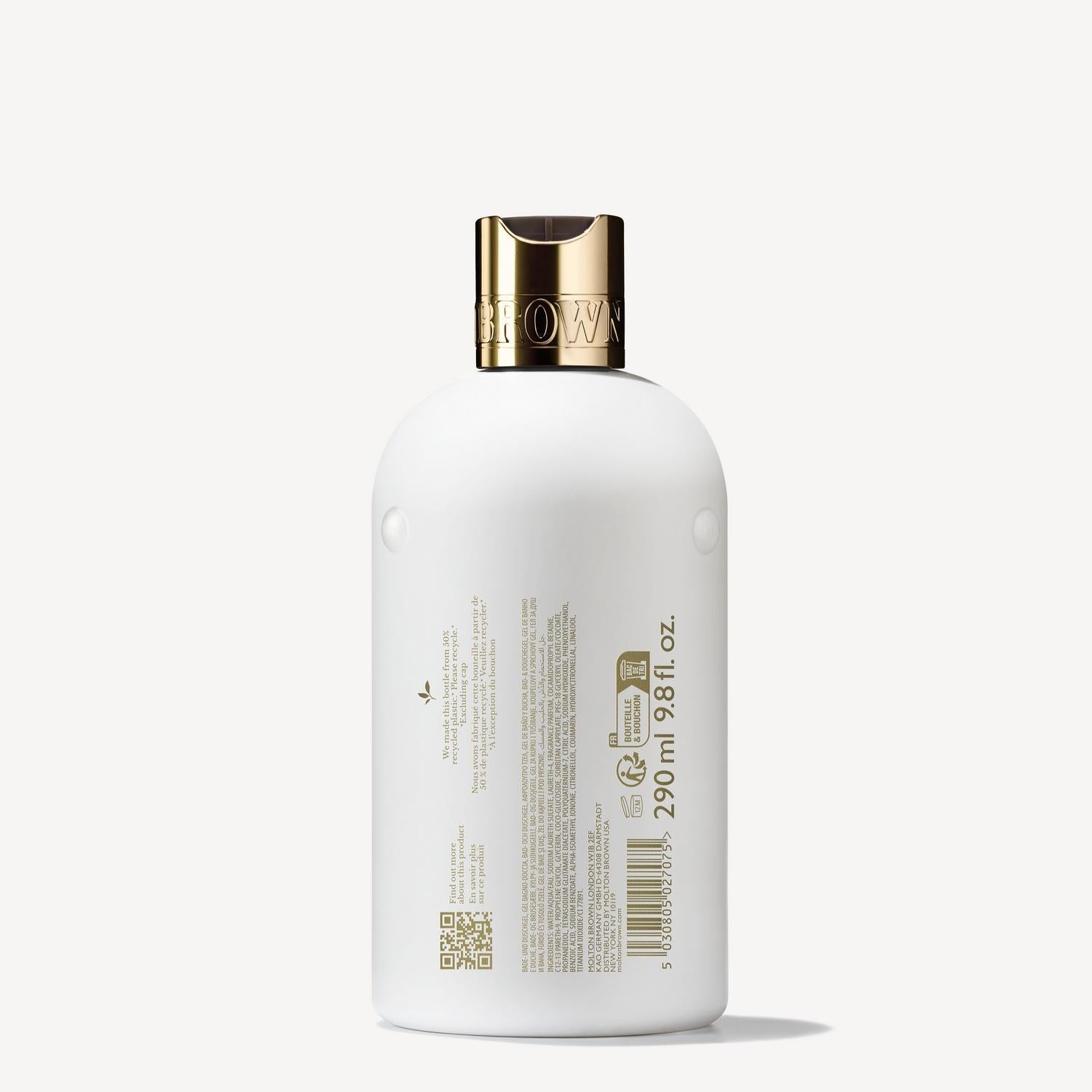 A bottle of Milk Musk Bath & Shower Gel 300ml by MoltonBrown Cyprus, featuring a white exterior with a gold cap, is adorned with various product details and barcodes against a plain light background.