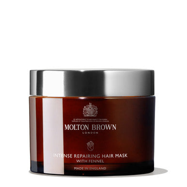 A 250ml jar of MoltonBrown Cyprus Intense Repairing Hair Mask with Fennel, ideal for rejuvenating damaged hair. The container is adorned with a silver lid and features a label displaying the brand's logo and product details. Made in England, this intensive hair mask promises a healthy-looking transformation.
