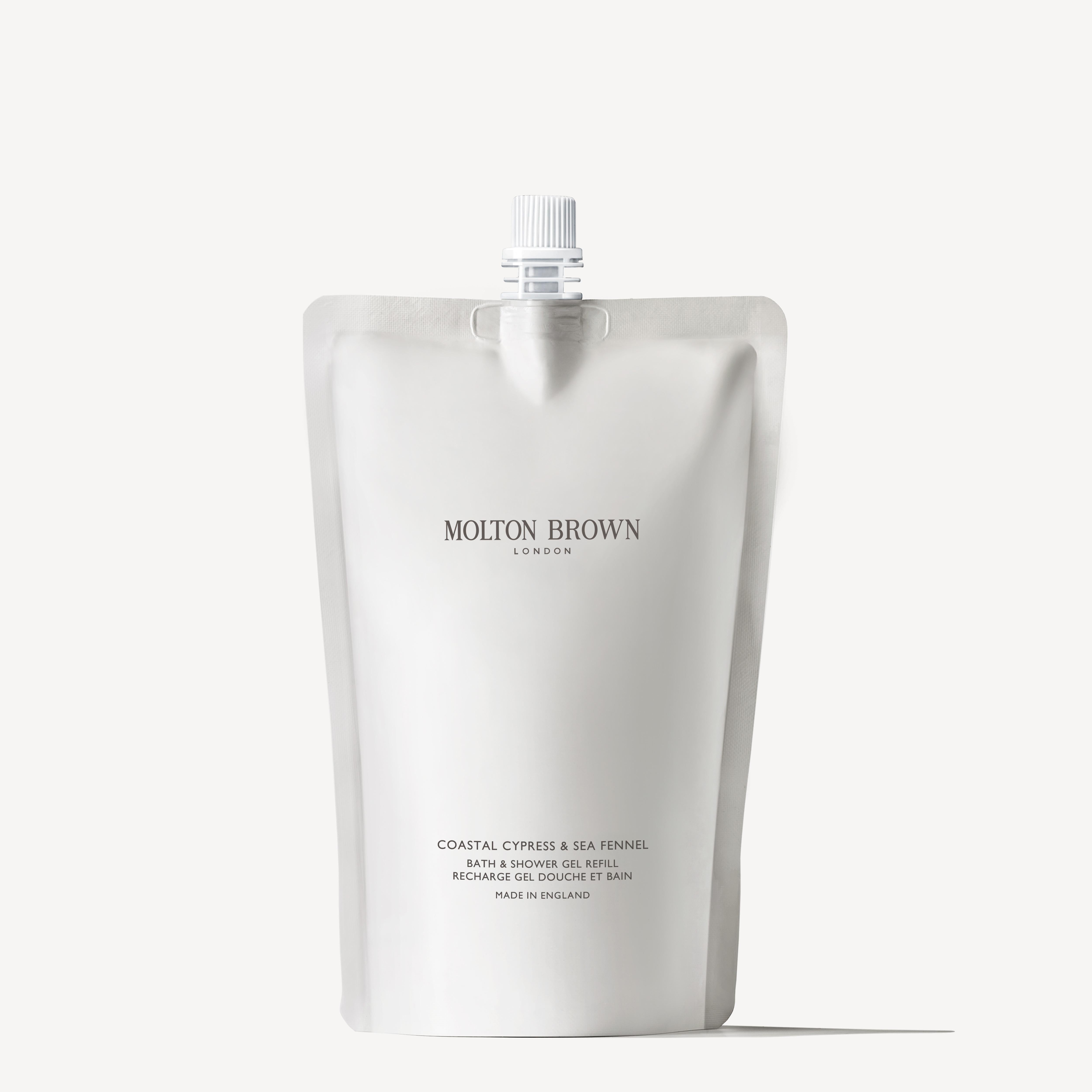 This minimalist pouch of MoltonBrown Cyprus Coastal Cypress & Sea Fennel Bath & Shower Gel Refill 400ml features a sleek white and gray design with a screw cap top and text detailing product information. The marine scent adds a refreshing touch to your bath routine.