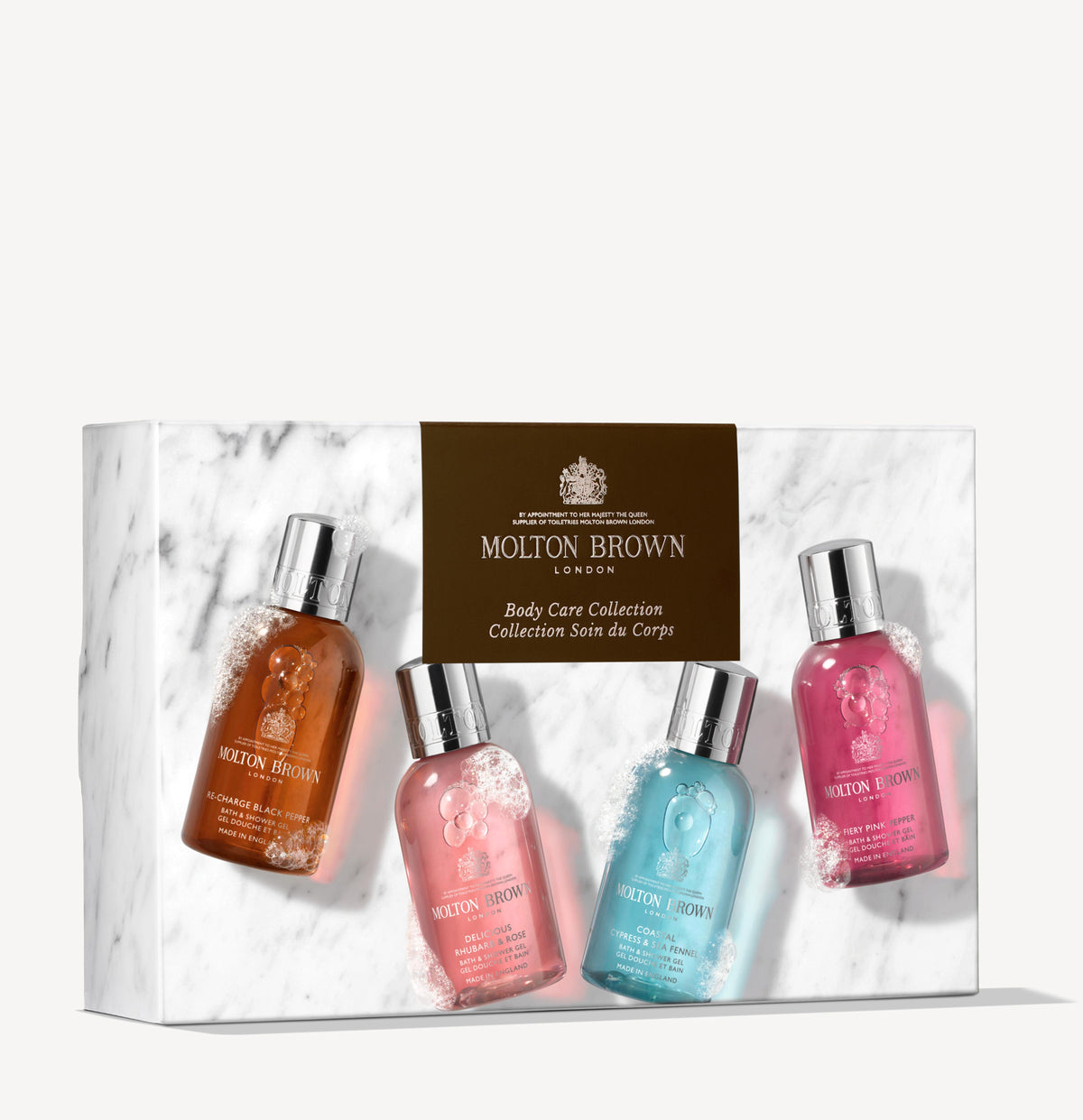 Introducing the Woody & Floral Body Care Collection by MoltonBrown Cyprus, a gift set that includes four travel-sized body washes, each with its own unique fragrance. Packaged in a marble-patterned box featuring an elegant gold label, this collection offers the ultimate travel bathing ritual.