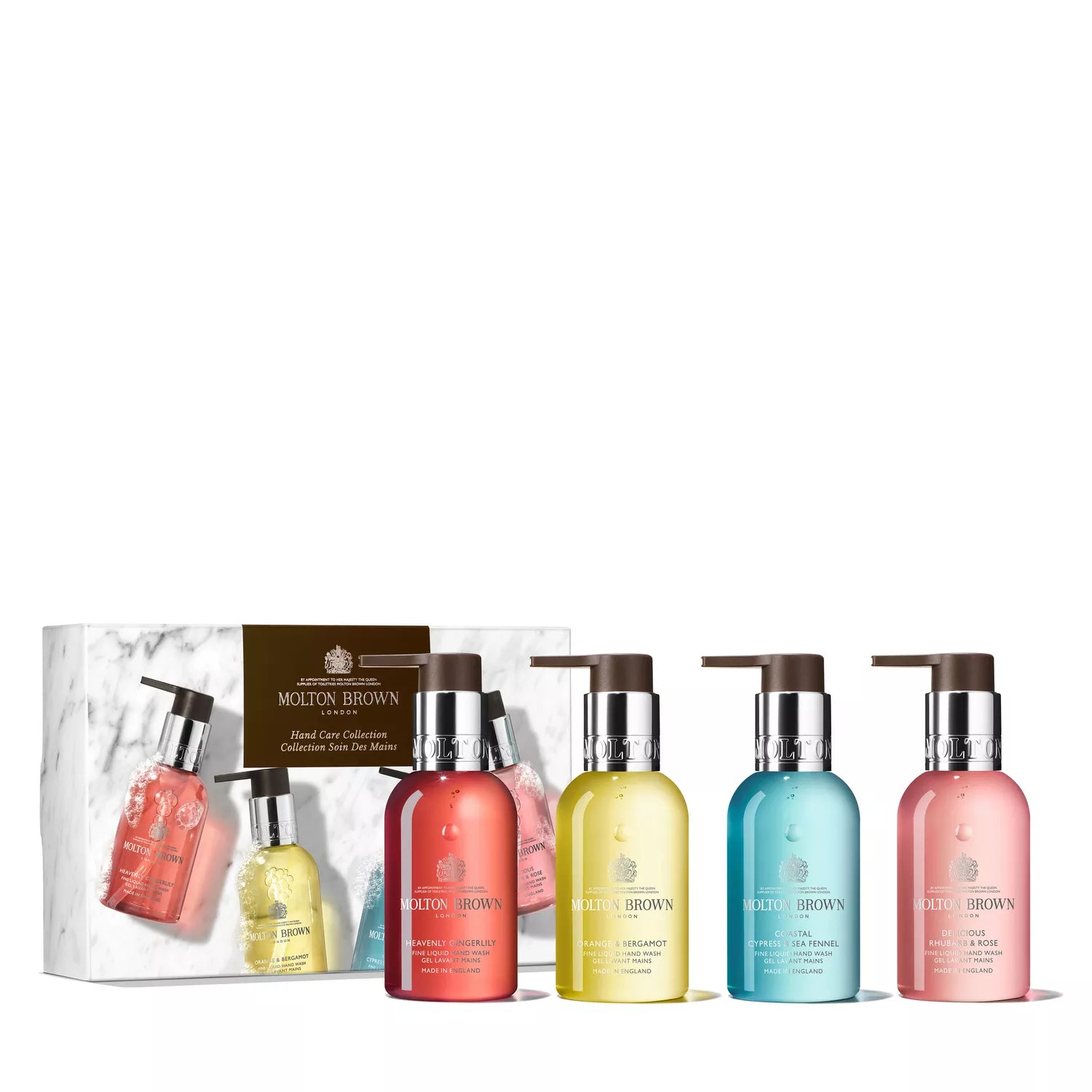 A set of four Fresh & Floral Hand Care Collection hand washes by Molton Brown Cyprus, with elegant pump dispensers. The colorful bottles are arranged in front of a matching branded box, each exuding fruity-floral fragrances.