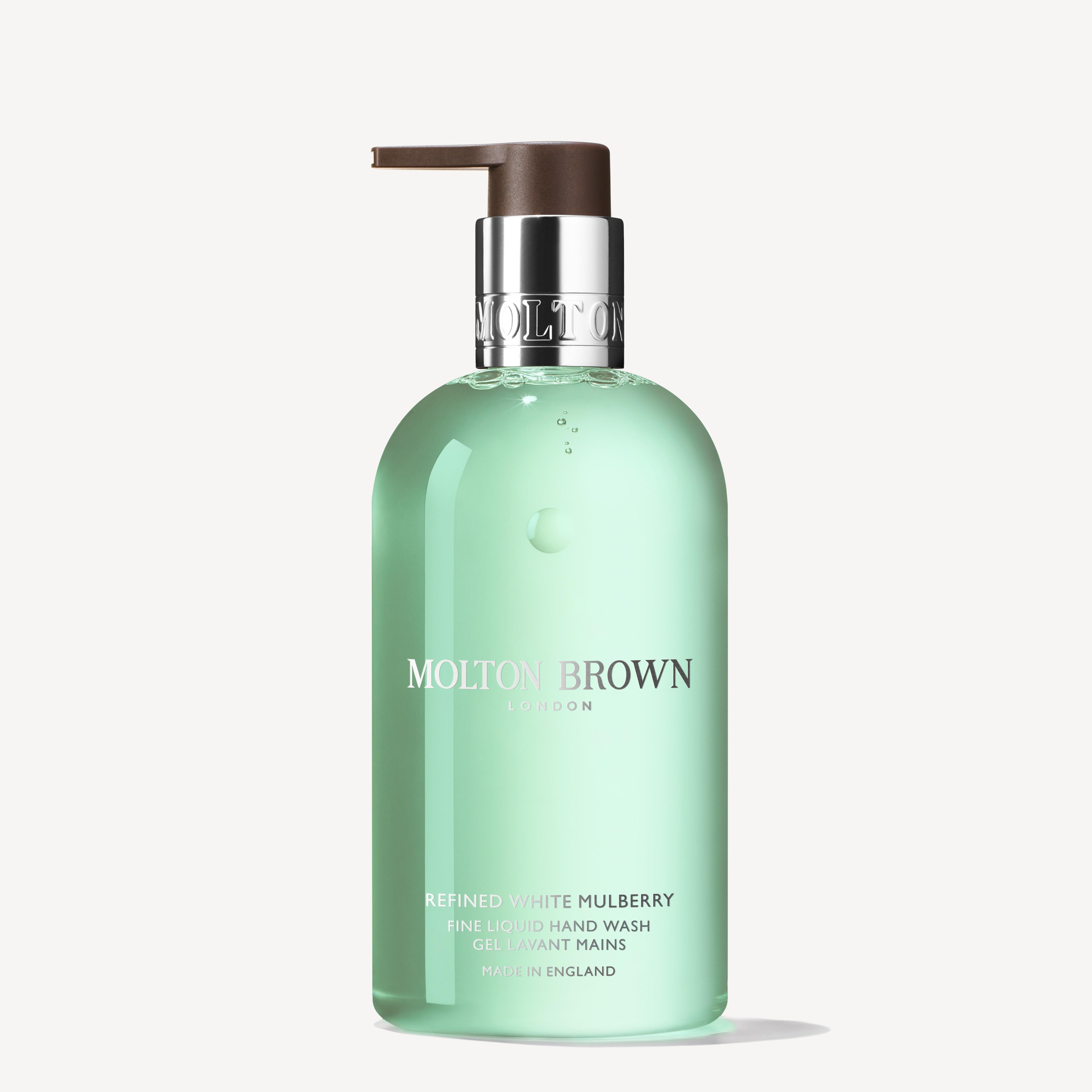 A bottle of MoltonBrown Cyprus Refined White Mulberry Fine Liquid Hand Wash 300ml with a pump dispenser features a translucent green design, elegantly accented with white text for branding and product information.