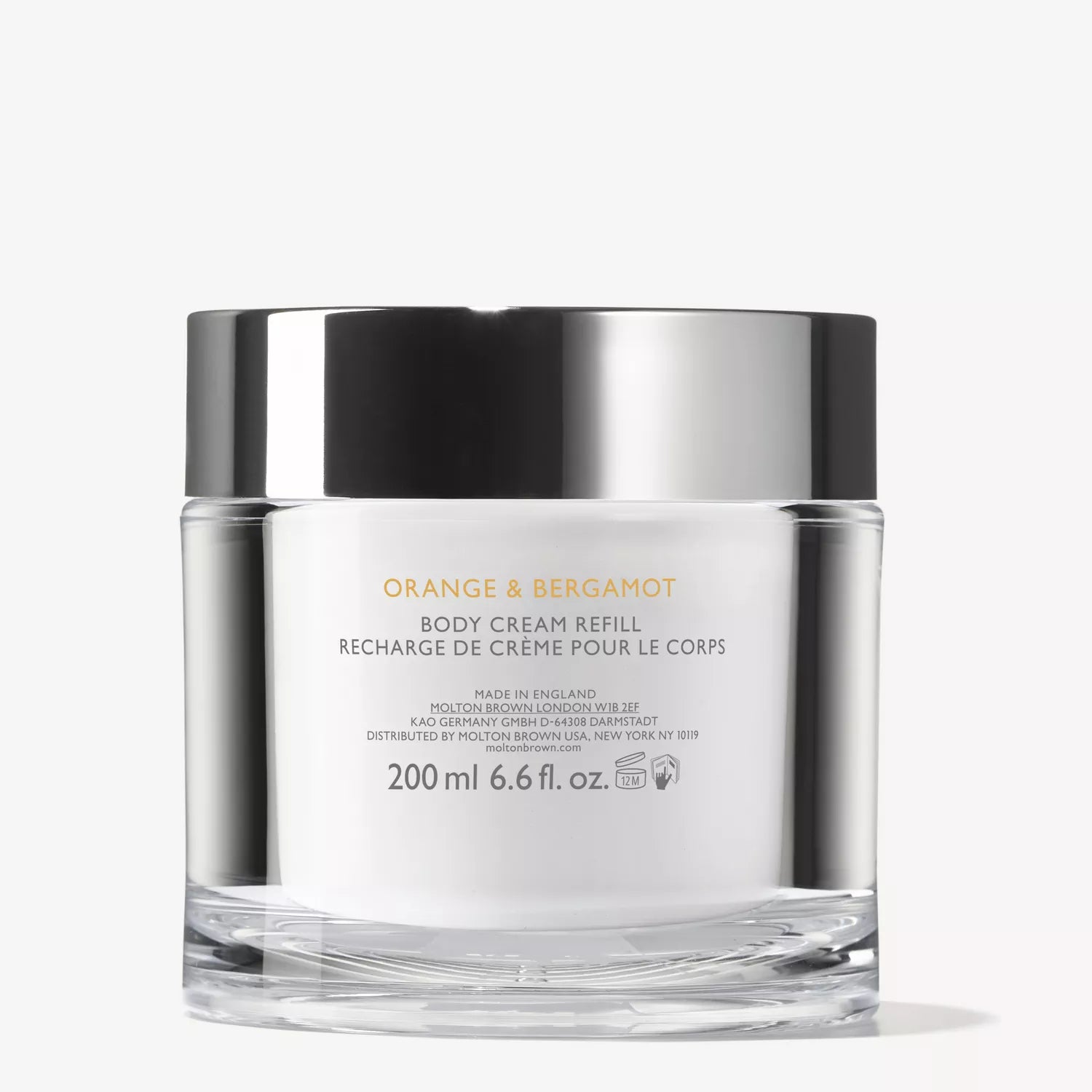A clear jar with a black and silver lid, labeled MoltonBrown Cyprus Orange & Bergamot Refillable Body Cream 200g. Enriched with cocoa butter for hydration, the label shows English and French product details.